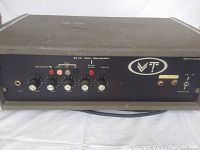 Front view of the Vibration Technologies VT EQ 140 amplifier head with control knobs and input/output jacks visible.