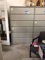 Photo of front view of six drawer lateral file cabinet showing overall size and condition.