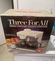 Photo of Salton Three For All espresso/cappuccino automatic coffee maker in its original packaging box showing product image and product details