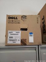Front view of the Dell branded box with handling symbols and barcodes visible on label.