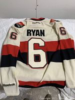 Full back view of the cream, red, and black Ottawa Senators hockey jersey showing Bobby Ryan name and number 6.