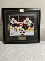 Front view of signed framed hockey action photo of Chris Neil and Mike Fisher in Ottawa Senators jerseys, with autographs visible and plaque below.