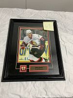 Front view of signed Jason Spezza Ottawa Senators photo with pin in black frame.