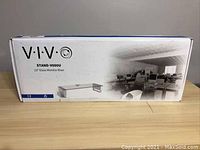 Box showing VIVO brand and model Stand V000U 23" Glass Monitor Riser