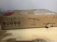 Box packaging with VIVO branding and model information.