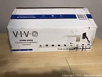 Box front of VIVO STAND-V001Q pneumatic arm single monitor desk mount with brand and model visible.