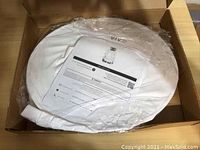 Sealed bee keeping jacket in white protective plastic inside VIVO branded cardboard box.