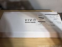 Closed box labeled VIVO MOUNT-KB05D with partial mounting instructions shown on label.