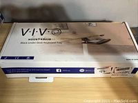 Closed box of VIVO MOUNT-KB03B Black Under Desk Keyboard Tray showing product branding and image on box top.