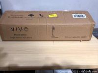 Closed cardboard box for VIVO Single Monitor Desk Stand STAND-V001D showing brand, model, and product name.