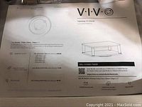 Close-up of VIVO Tabletop TV Stand user manual showing product image and specifications.