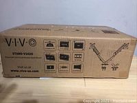 Box showing branding and monitor mount features.