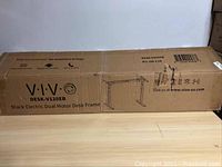 Sealed cardboard box labeled VIVO DESK-V120EB Black Electric Dual Motor Desk Frame