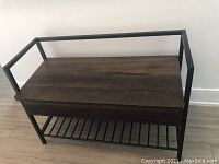 Front view of bench with flip top closed