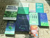 Books with titles related to medical herbalism, phytotherapy, nutrition, human physiology, food studies, plant medicine, and herb-drug interactions.