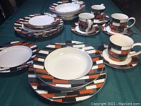 All items of the set arranged showing the full geometric pattern and number of pieces.