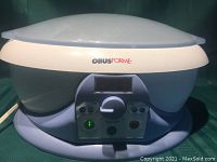 Full view of OBUSFORME paraffin wax spa machine showing body and lid with control panel below