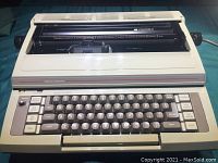 Front view of the off-white Smith-Corona Citation II electric typewriter showing keyboard and paper roller.