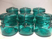 Six green Ball Ideal wire bail glass storage jars, displayed together
