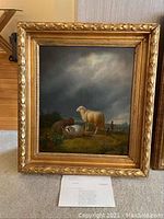 Full view of framed oil painting with appraisal document visible below