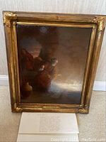 Framed oil painting full view including appraisal paperwork at base