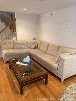 Full view of two-piece sectional sofa in living area