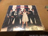 Front cover of Blondie LP with band members and Debbie Harry in white dress