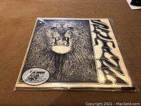 Front cover of Santana LP showing the lion illustration with the band's name.