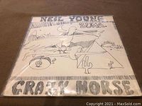 Front album cover of Neil Young & Crazy Horse LP titled "Zuma" with black and white line art illustration
