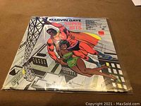 Front cover of the Marvin Gaye Super Hits album with colorful superhero comic illustration.