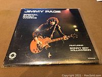 Front cover of the Jimmy Page Special Early Works vinyl LP showing Jimmy Page with guitar with the album and artist name and featured artist Sonny Boy Williamson.