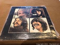 Front cover of The Beatles 'Let It Be' LP vinyl record showing photos of the four band members.