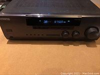 Front view of Kenwood VR-205 receiver showing digital display tuned to 87.50 FM and front control knobs.