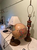 Wide view showing all three lamps on a table with cords and plugs visible.