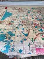 Close-up view of the map surface showing detailed streets, lakes, roads, and school boundaries.