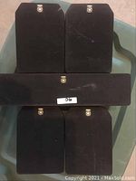 Photo showing five Yamaha speakers: two medium-sized, one long horizontal center speaker, and two smaller speakers all with black fabric covers and Yamaha logos.