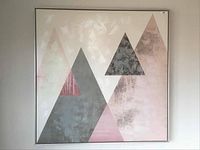 Front view of abstract geometric triangle art print on canvas in a metallic frame