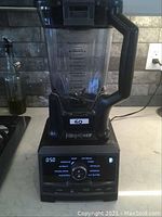 Front view of Ninja Chef blender showing digital display and control dial.