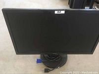 Front view of Acer 21.5 inch LCD monitor with VGA cable and power cord coiled on the base stand.