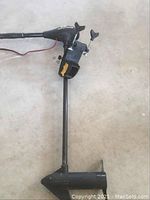 Full motor showing control head, shaft, clamp mount and propeller