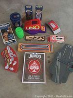 Full lot showing all included games and accessories on floor.