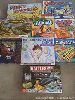 Photo showing all games: Funky Monkeys, Operation, Trouble, Guess Who, Chemistry Lab, Connect 4, Spider-Man 3, Volcano Island, GI Joe Battleship