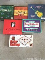 Top view of all six board game boxes arranged on the floor: Outburst, Adversity, Countrified, Absolute Balderdash, Scattergories, and NHL Hockey Challenge.