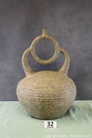Full view of large pottery piece showing overall shape, size, texture, and color.