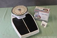 Both Healthometer scale and Mark of Fitness blood pressure monitor box together side by side