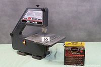 Full view of 10-inch Craftsman direct drive band saw with a blade set box.