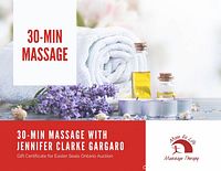 Promotional image of a 30-minute massage including rolled white towels, massage oil bottles, candles, and lavender sprigs.