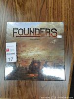 Front view of the sealed Founders board game box showing title and artwork.