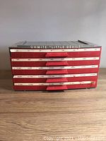 Front view of the closed Ohmite Little Devils storage cabinet labeled with resistor values.