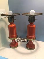 Pair of vintage Ethan Allen hurricane lamps on a table, showing overall size, shape and color